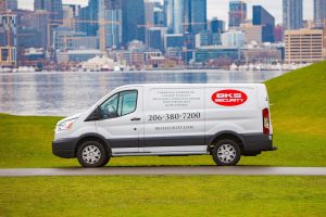 A BKS Security van overlooking Seattle, ready to offer affordable locksmith services.